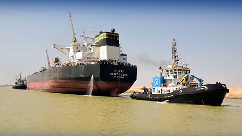Crude oil tanker Burri at Suez Canal with tugs