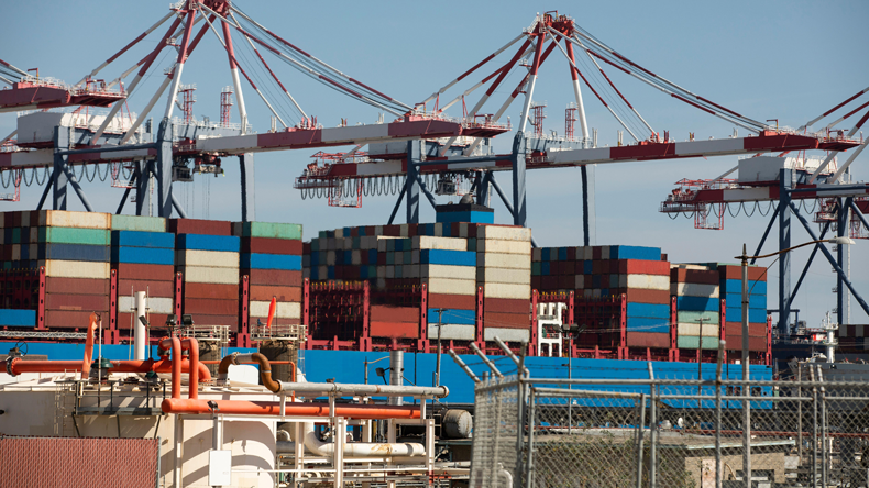 Cranes unloading containership