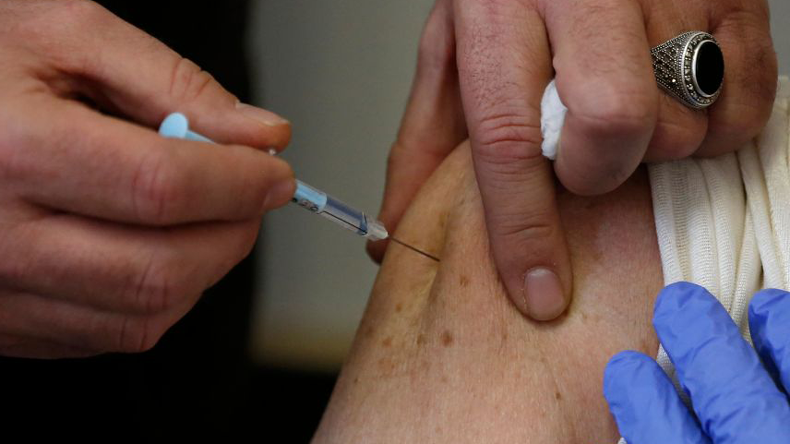Covid vaccine injection. Credit Abbas Momani / AFP via Getty Images