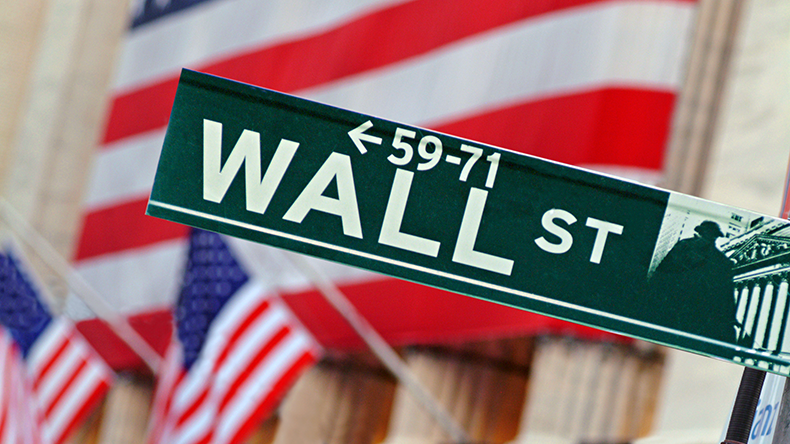 Wall Street sign in front of New York Stock Exchange in New York