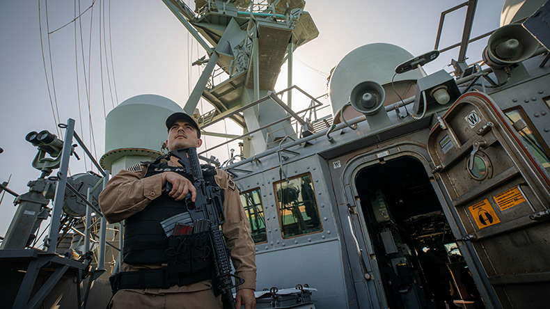 Lt stands watch on  guided-missile destroyer USS Carney (DDG 64). Carney is deployed to the U.S. 5th Fleet in the Middle East region