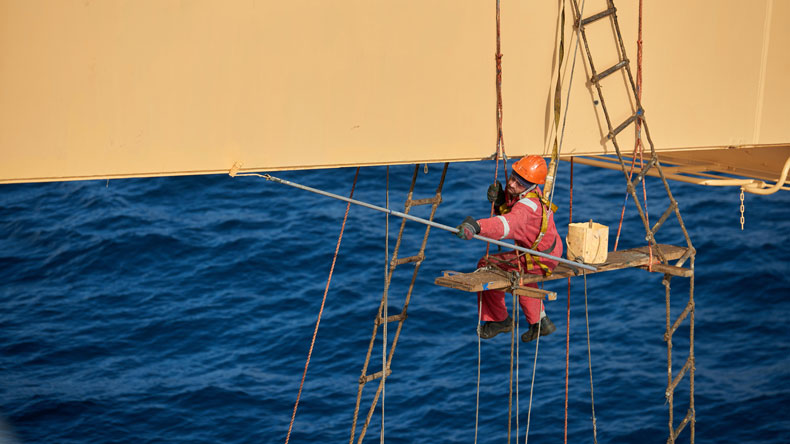 Seafarer painting aloft