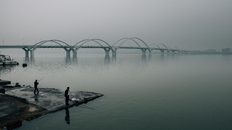 Fishermen on the Han River near Chaozhou port in China 