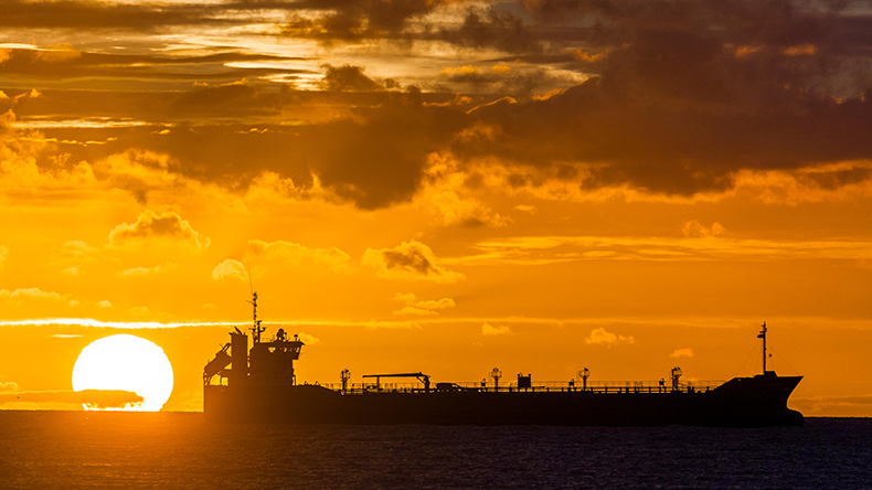 Oil tanker at sunrise