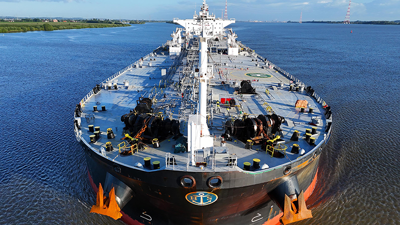 View from front of a crude oil tanker on a river 