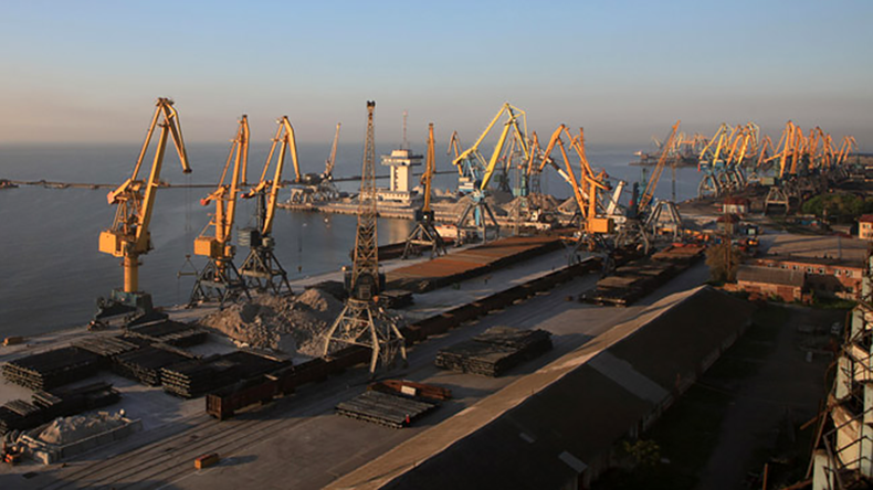 Mariupol port with loading cranes and bulk ships
